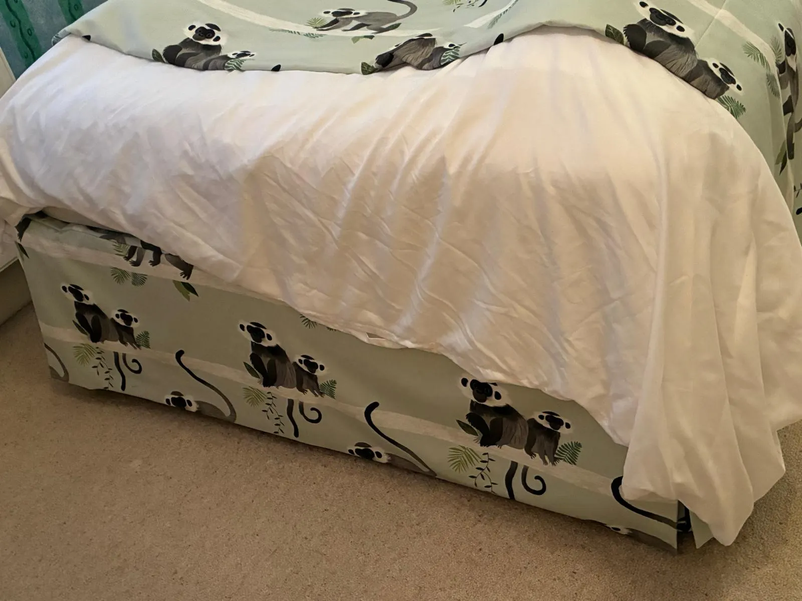 Handmade fitted bed valance matching the room’s curtains